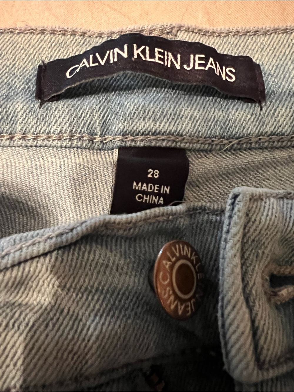 Calvin Klein distressed light blue jeans.